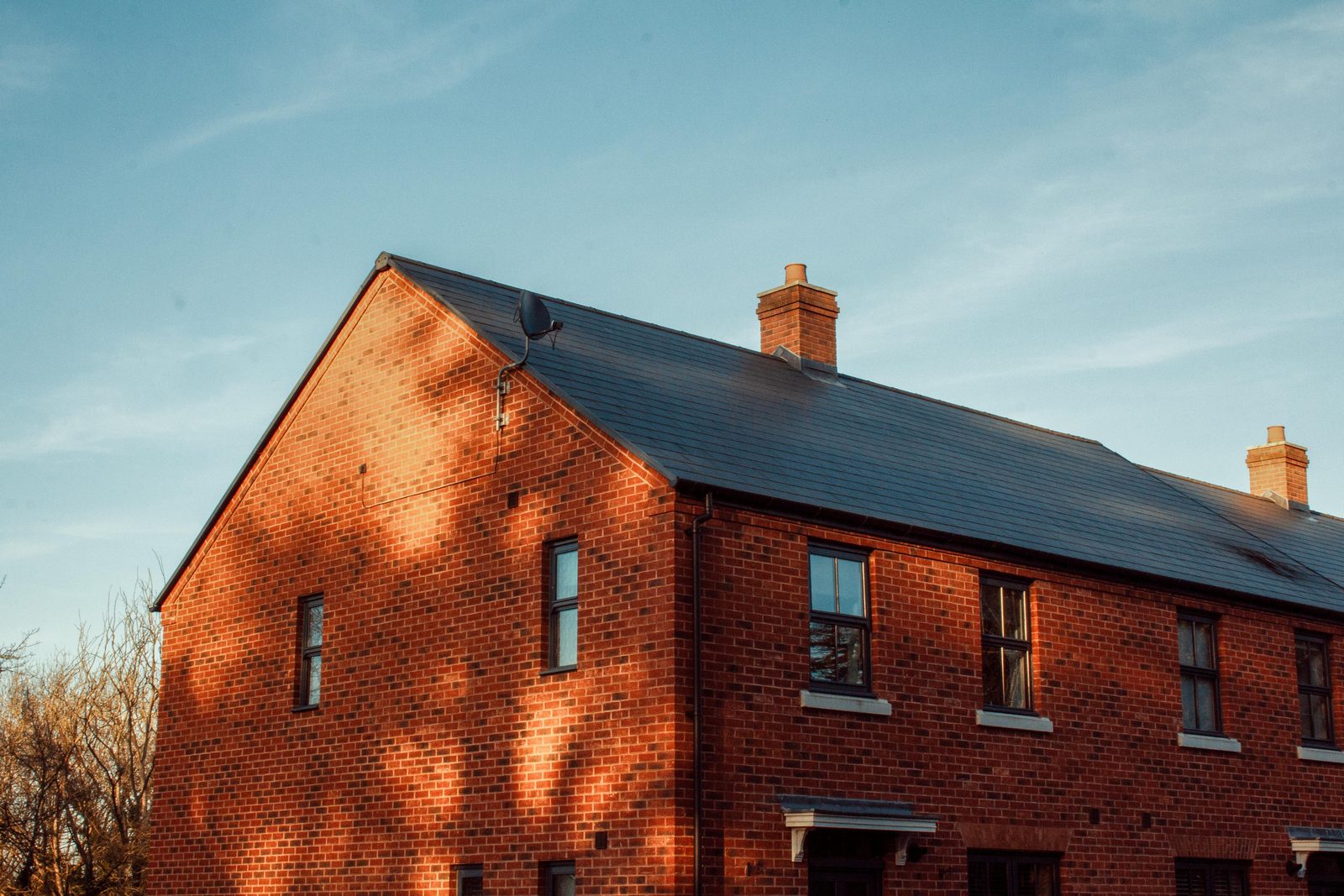Brick new-build home with slate roof